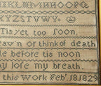 Antique 1829 English sampler in original frame, hand-stitched with alphabet, numbers, and hymn by Sarah Ash. Ready-to-display historic embroidery.