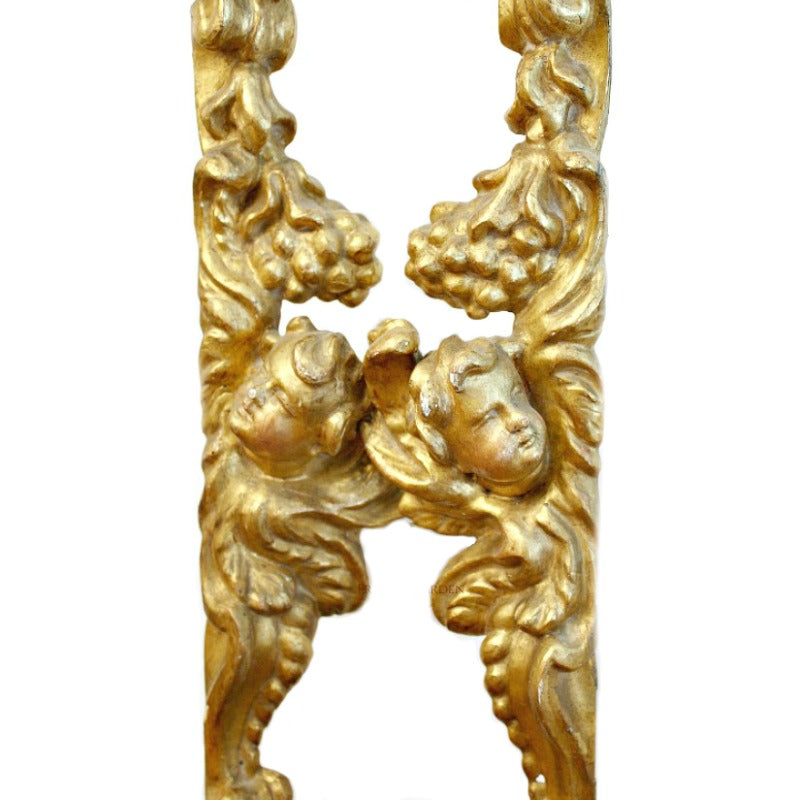 Detailed view of antique French angel fragment carving and timeworn patina