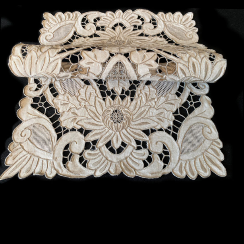 Complete set of twelve antique embroidered linen placemats from a Madeira estate collection
