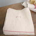 Folded 19th Century French family linen tablecloth with hand woven texture