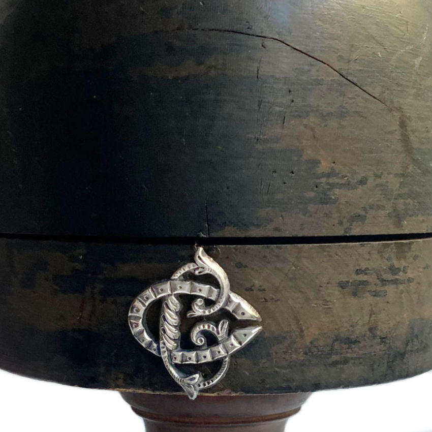 French 19th Century millinery shop display wood hat block stand with a monogram, showing signs of aging and use.