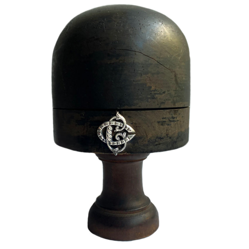 French 19th Century millinery shop display wood hat block stand with a monogram, showing signs of aging and use.