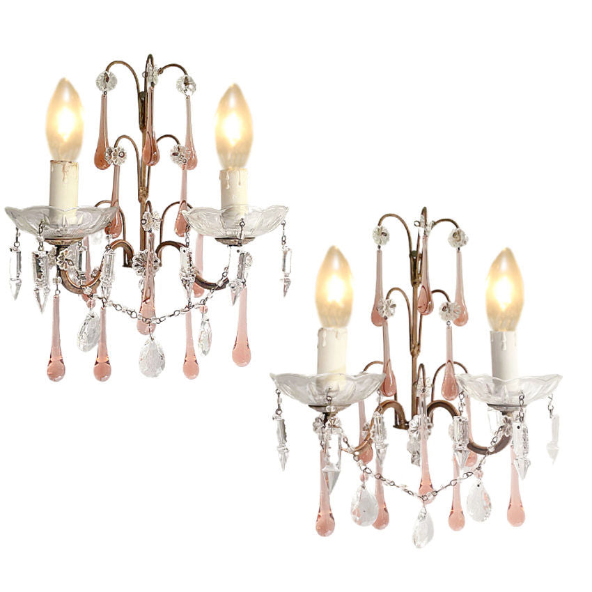 Suggestion


A pair of antique French two-light wall lights with pink apricot crystals and beaded details.