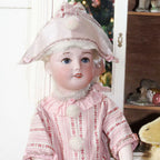 Discover a rare French bisque SFBJ Jumeau doll, marked and exquisitely detailed, perfect for collectors seeking timeless elegance and historic charm.