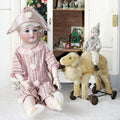 Discover a rare French bisque SFBJ Jumeau doll, marked and exquisitely detailed, perfect for collectors seeking timeless elegance and historic charm.