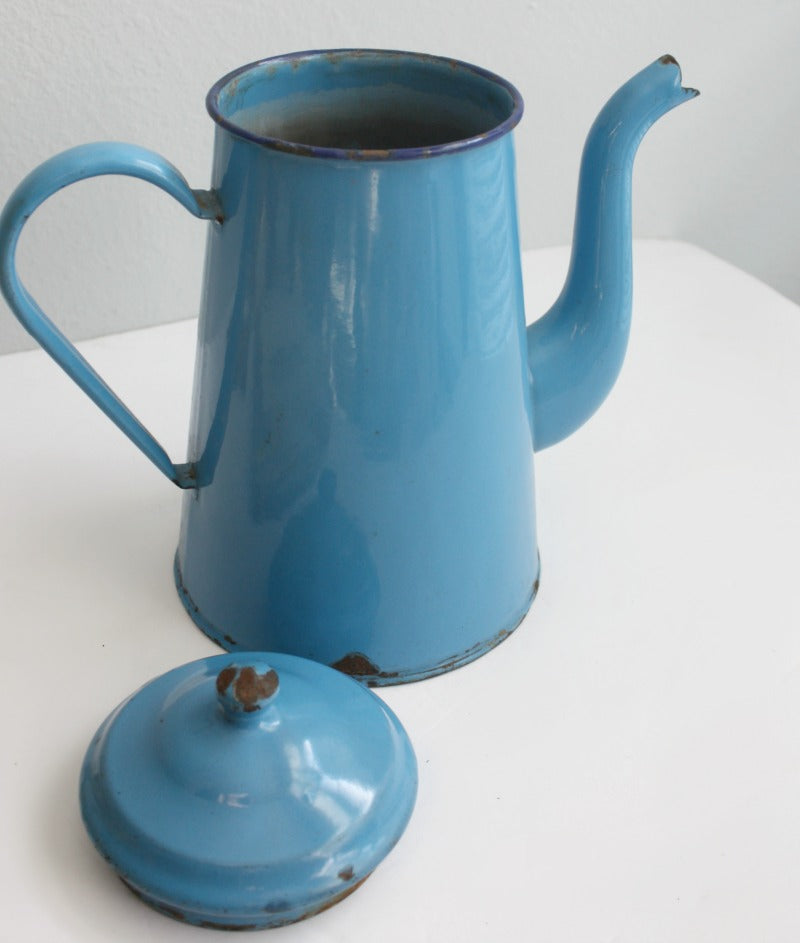 Antique-style French blue enamel coffee pot with patina detail and European kitchen charm