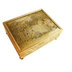 An exquisite French engraved jewelry box with a pastorale scene on the top, featuring a young man holding a bird and a young woman reaching towards it, with floral and scrolling detail on the sides.