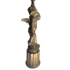 side view of vintage gilt metal cherub table lamp with bird
