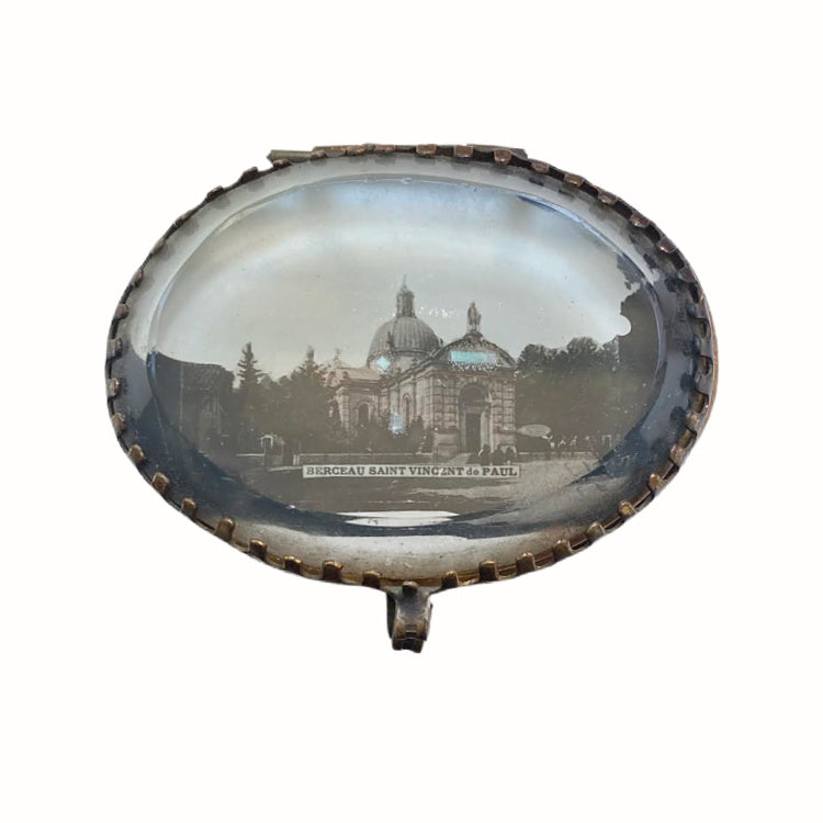 Detail of antique French gilt souvenir box of Cathedral St. Vincent de Paul. The image of the cathedral is under the thick beveled glass top.