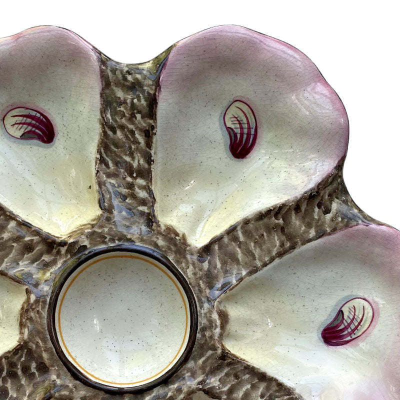 Close-up of hand-painted oyster scars, pink and soft yellow tips
