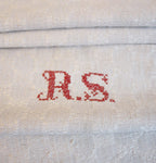 Hand embroidered French Country linen towel close up of monogram in red