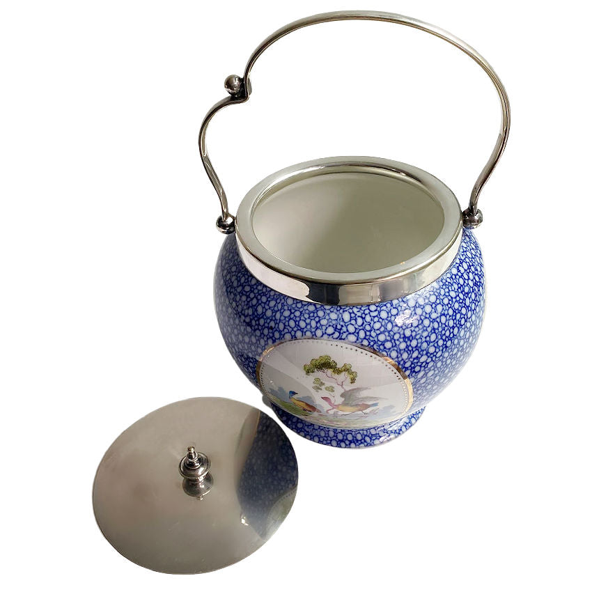close up of inside, silver plated lid and handle on antique biscuit barrel