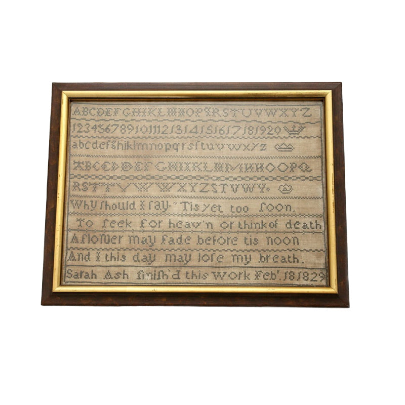 Antique 1829 English sampler in original frame, hand-stitched with alphabet, numbers, and hymn by Sarah Ash. Ready-to-display historic embroidery.