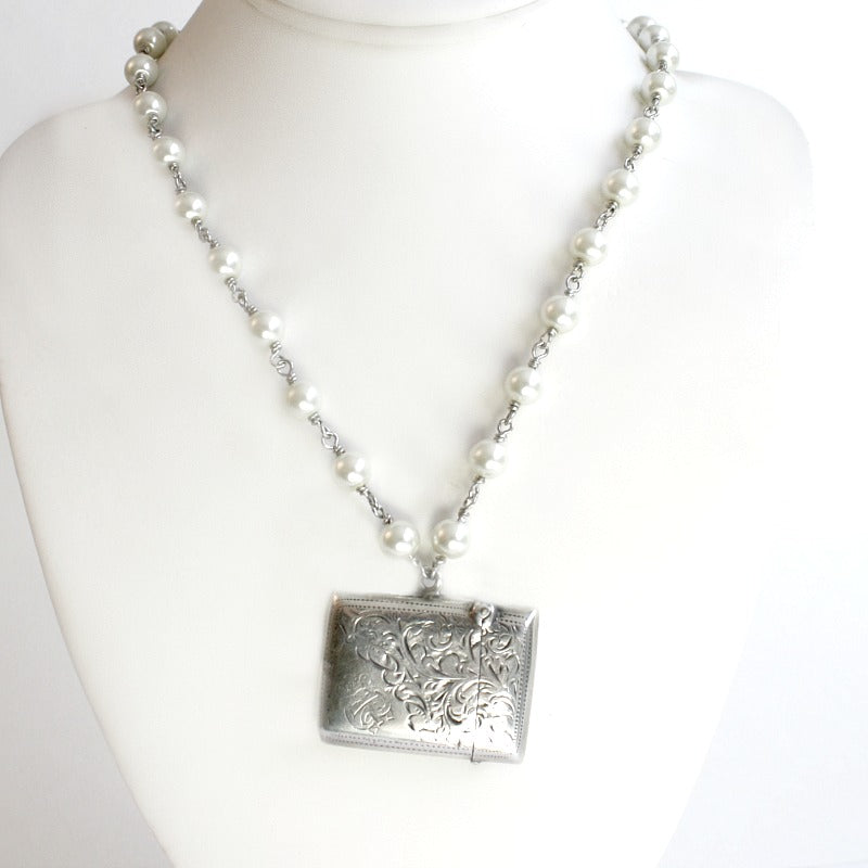 Antique sterling silver English vesta necklace with engraved match safe and pearl chain. A rare heirloom piece of antique jewelry.