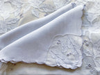 Rare periwinkle blue Madeira linen and organdy placemat set with runner, hand-embroidered leaf and floral design, collector-quality vintage table linens. Close up view of napkins