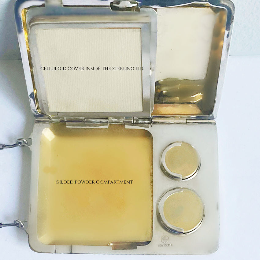 Gilt interior antique minaudière showing card and coin sections