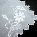 Elegant early 20th-century linen Madeira linen placemat with exceptional floral hand embroidery.