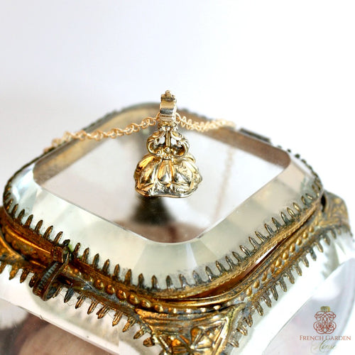 19th century lady’s wax seal necklace featuring a heliotrope shield fob. Elegant antique jewelry with rich symbolism and heirloom appeal.