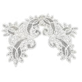 A creamy white antique bobbin needlelace linen lace collar with a floral pattern and undulating scroll work.