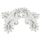 A creamy white antique bobbin needlelace linen lace collar with a floral pattern and undulating scroll work.