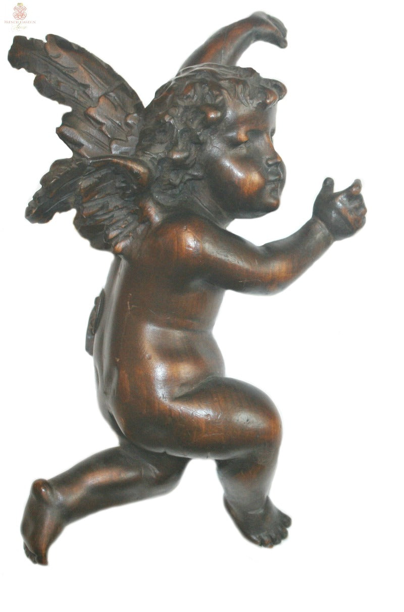 Late 18th century Italian carved wooden cherubs with aged patina and original hanging hardware