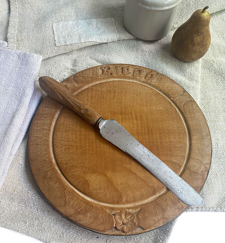 Antique English hand carved bread board floral