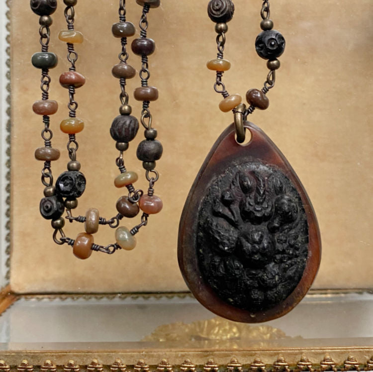 Antique Victorian gutta percha pendant on a tonal semi-precious beaded chain, 19th century, rare collectible jewelry, exquisite craftsmanship, collector’s piece.