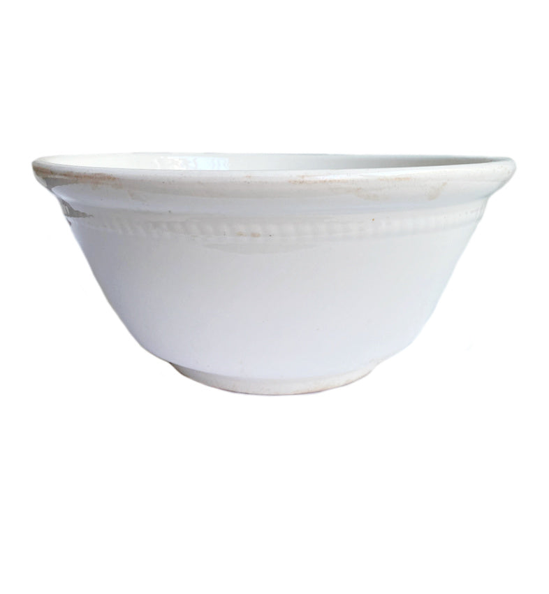 Oversized vintage white ironstone serving bowl with honest age and timeless kitchen table presence
