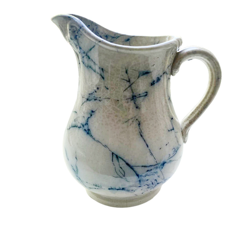 Rare antique ironstone pitcher in blue and white marble design