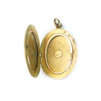 Interior of antique locket with original removable photograph frames