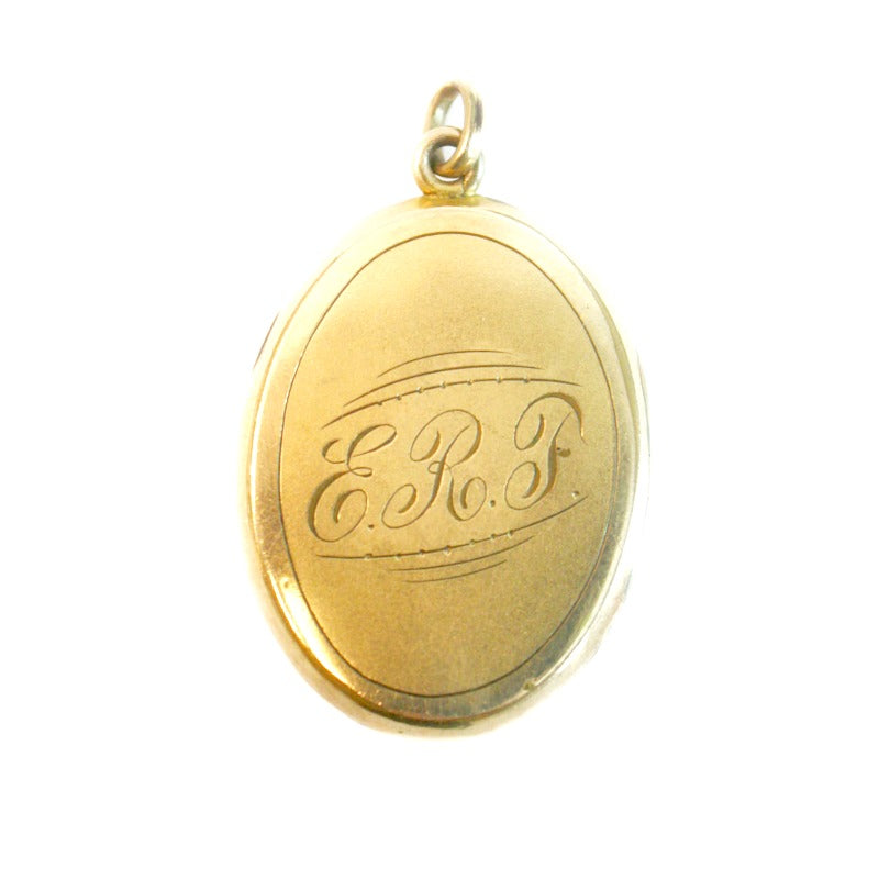Back of antique gold-filled locket with E R F monogram