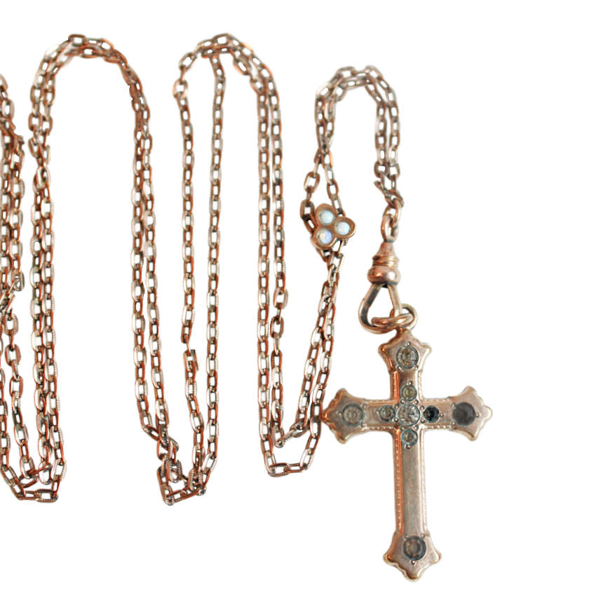 Large burnished antique gold cross with 14 karat gold filled link chain necklace. Teardrop blood garnet briolette dangles store in the center.