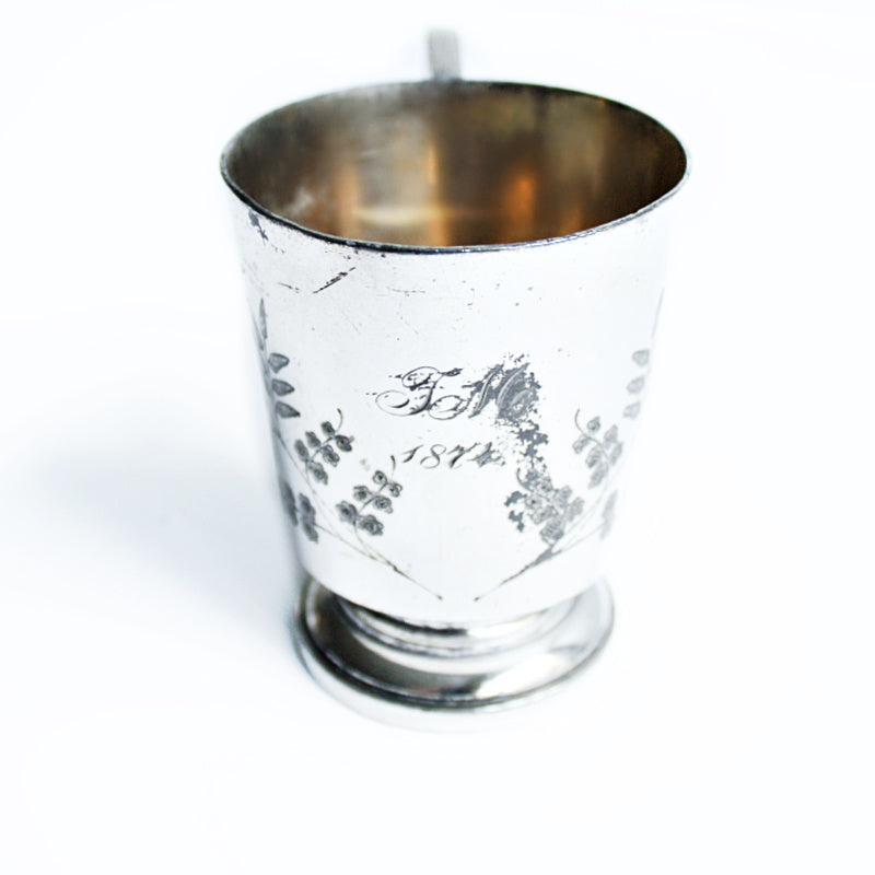 antique silver christening cup with ferns