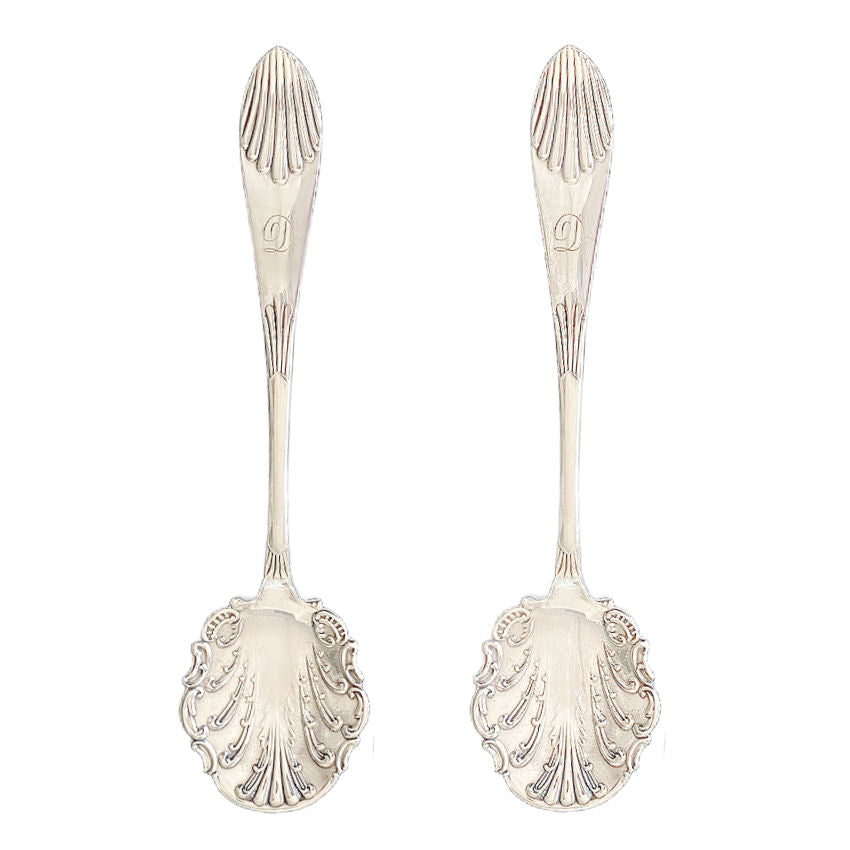 Pair of antique silver-plated jam spoons, monogrammed “D” and hand-engraved with rococo shell and leaf motifs. 