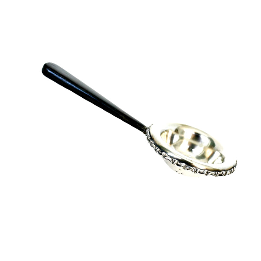 sterling floral and ebonized handle tea strainer