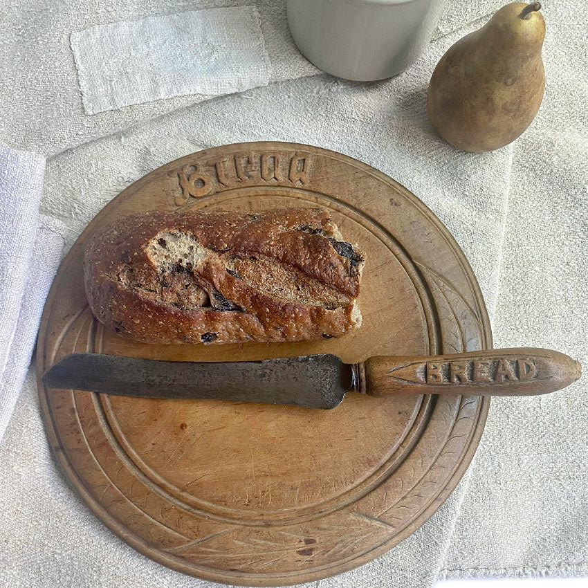 antique Victorian round bread board with matching knife