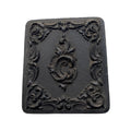 Antique Littlefield Rococo Scroll Union Case, Civil War era thermoplastic photographic case measuring 2-1/2" x 3", empty with original glass and one broken hinge.