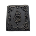 Antique Littlefield Rococo Scroll Union Case, Civil War era thermoplastic photographic case measuring 2-1/2" x 3", empty with original glass and one broken hinge.