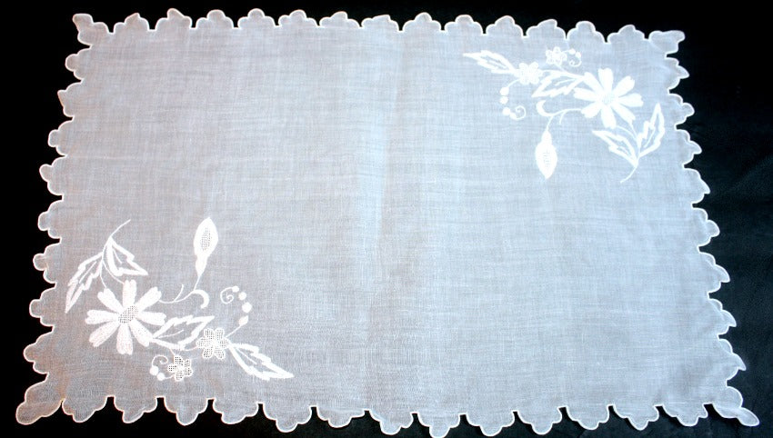 Estate Madeira placemat in pristine white organdy. Hand-embroidered with padded satin and appliqué floral designs. 