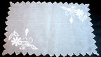Estate Madeira placemat in pristine white organdy. Hand-embroidered with padded satin and appliqué floral designs. 