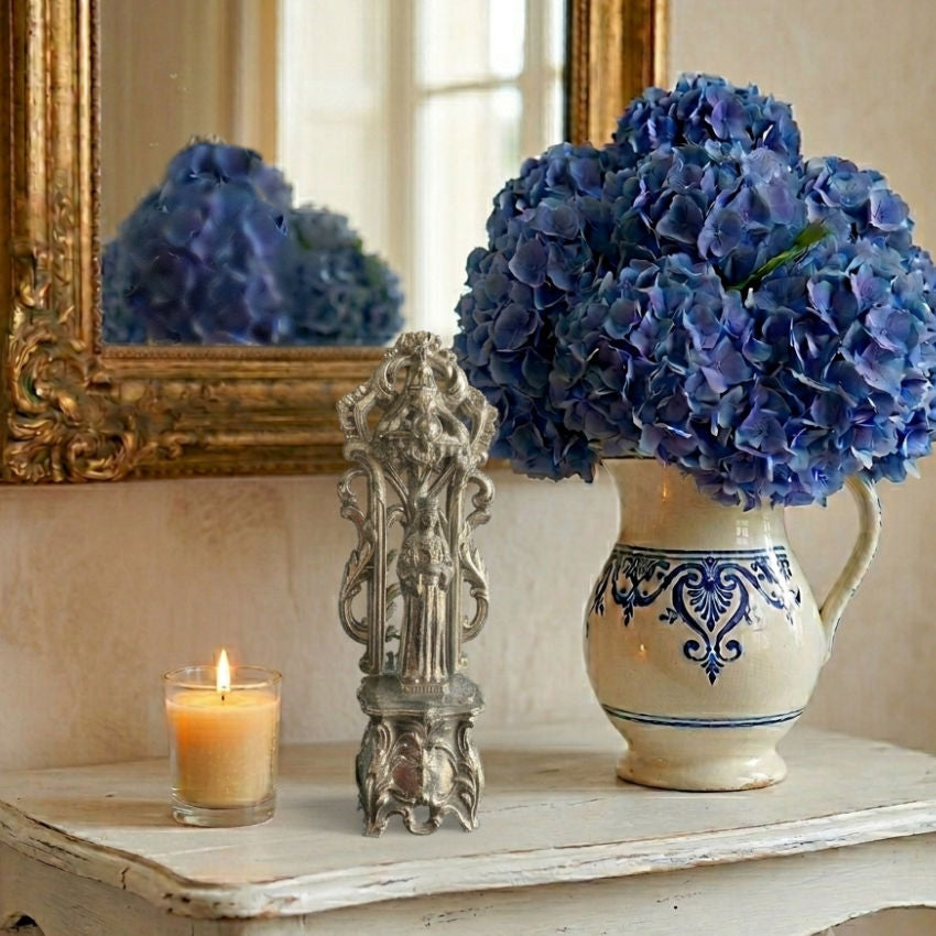 Antique French devotional treasure for your home with vase of blue hydrangeas in french country setting