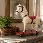 Antique cream horse displayed on French Country cabinet