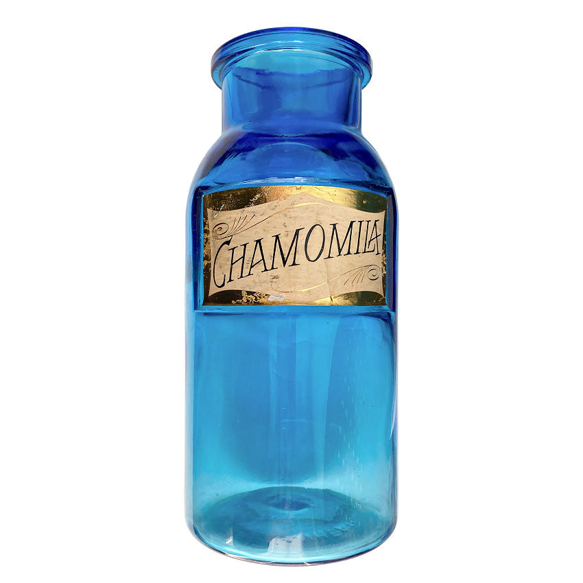 Antique blue apothecary jar with original Chamomila label. Hand-blown glass with luminous color and authentic 19th century pharmacy charm.