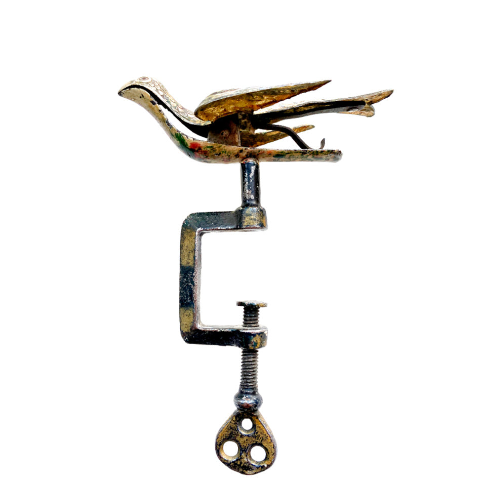Side view of Victorian brass sewing bird with articulated beak and steel clamp