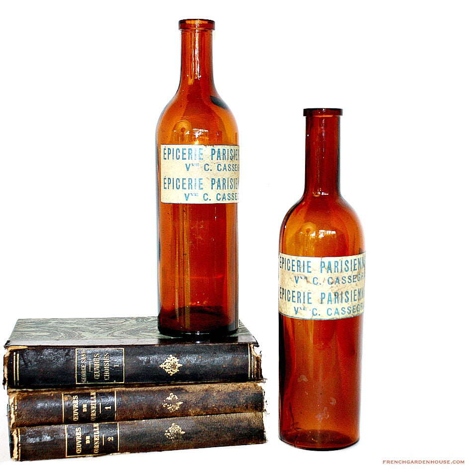 Close detail of antique amber glass bottles with rich patina and glow