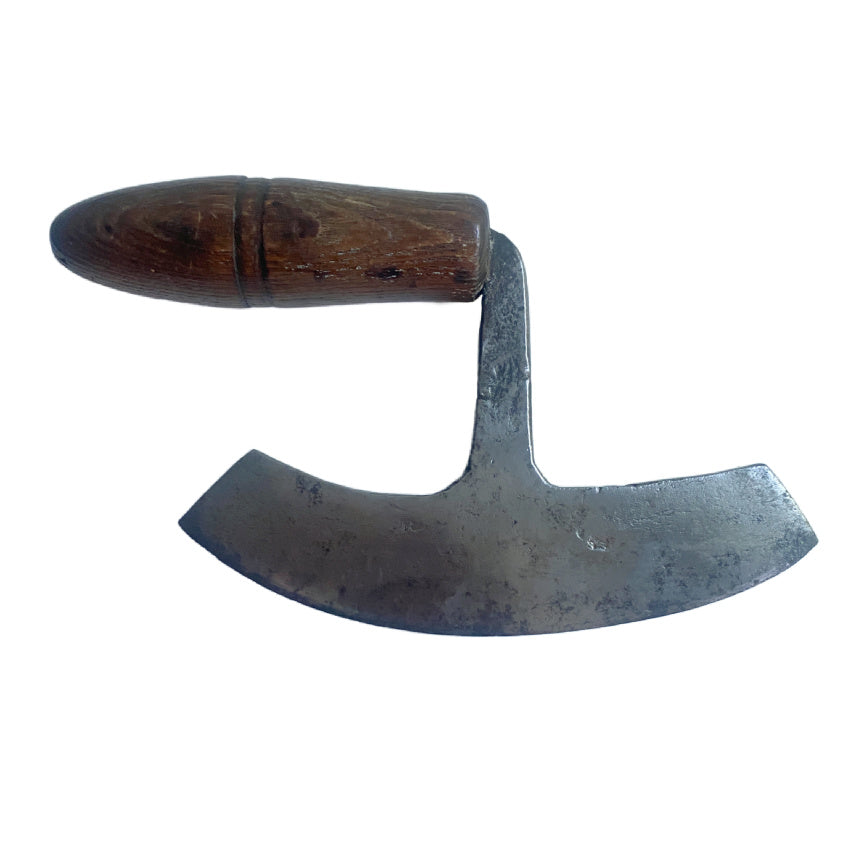 Old-fashioned sickle with wooden handle on a white background
