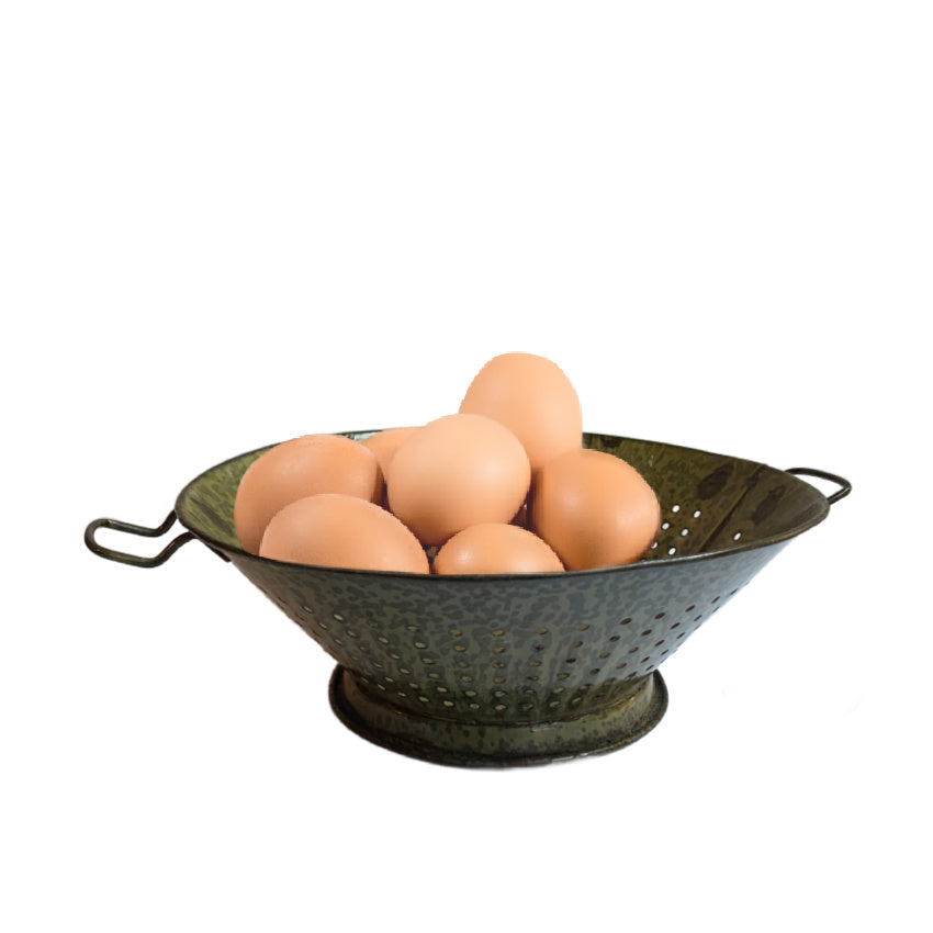 Antique green enameled country colander, rustic charm, collectible home accent, gently worn, striking decorative piece for kitchen or display. 