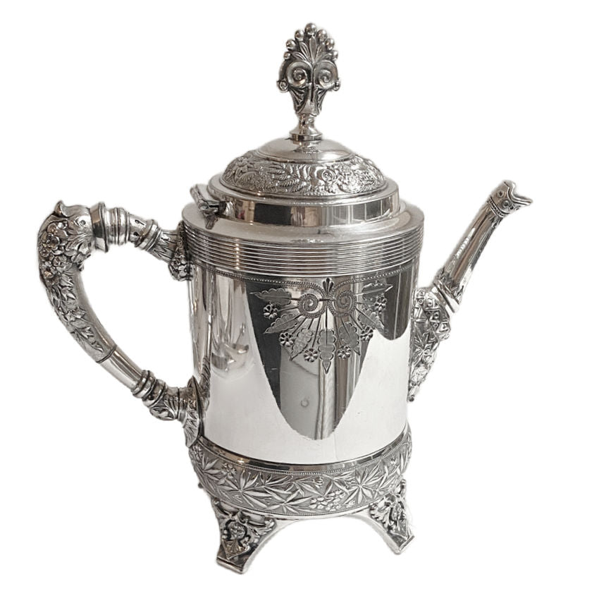 Pair of ornate antique Meriden Britannia silver plated teapots, richly detailed with Victorian repoussé and engraved designs. Elegant display pieces for your home. 1870