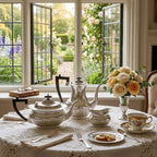 Vintage English tea set styled on lace table with roses