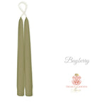 Bayberry Green bayberry wax taper candles in antique silver candlesticks with bayberry branches